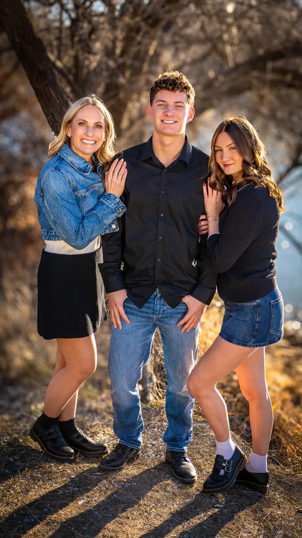 Family of three by the river
